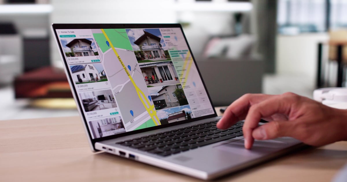 Investor researching properties online at home