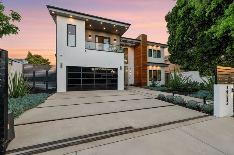 Luxury home at twilight with pool and patio