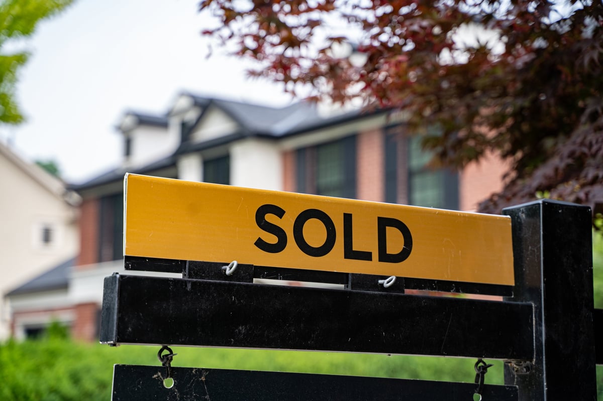 Sold sign in front of a house