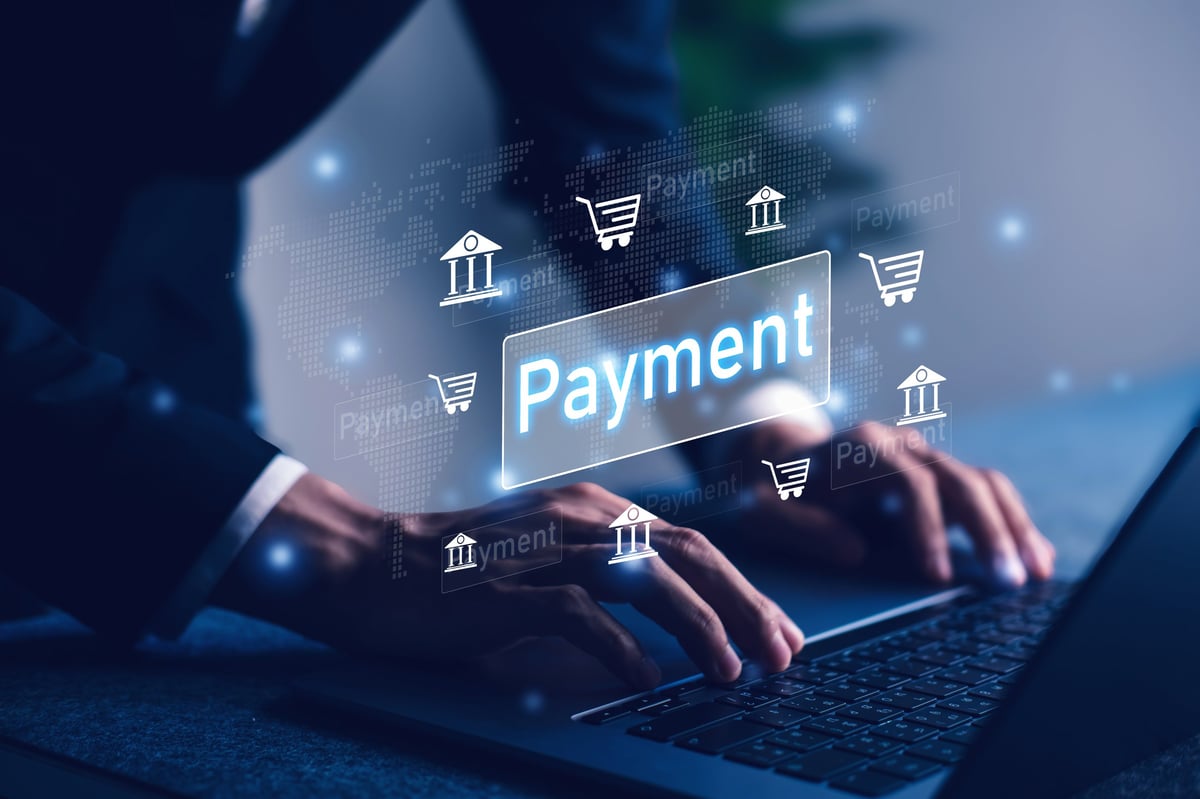 Typing on a laptop while making online payments