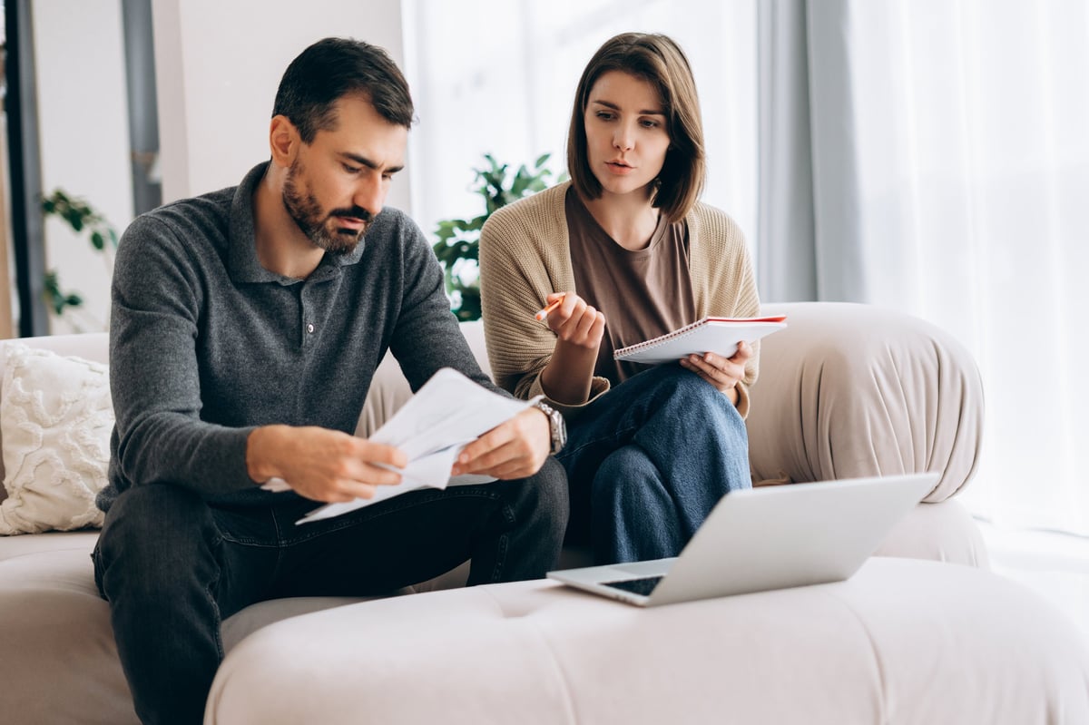 Couple reviewing household budget at home