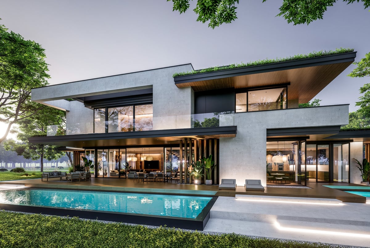Modern California home with pool and beautifully landscaped yard at dusk