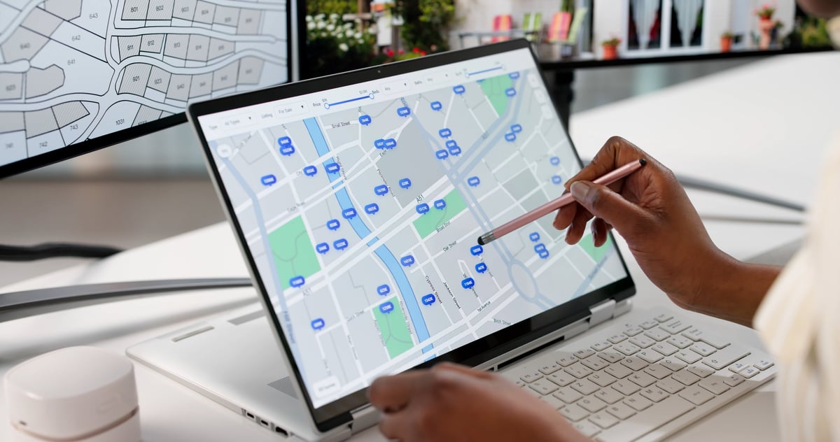 Young Female Real Estate Planner Searches For Land Online.