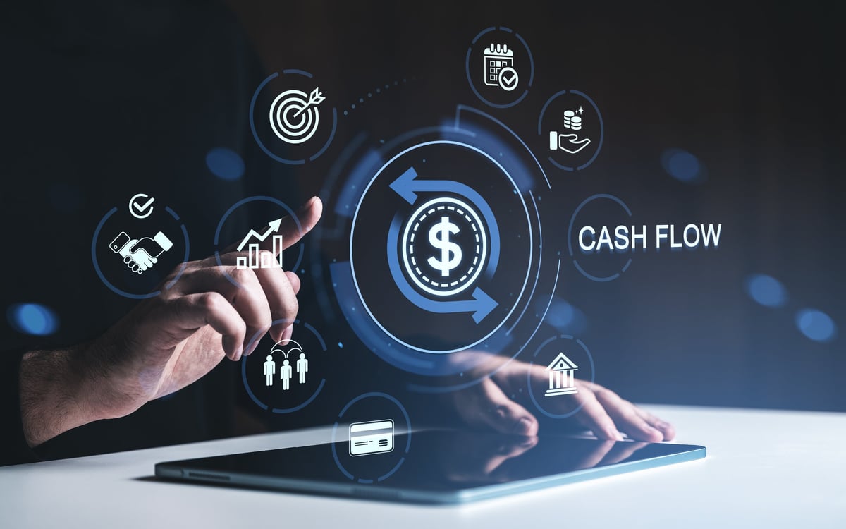 Hand touching digital cash flow icons representing finance and money management insights