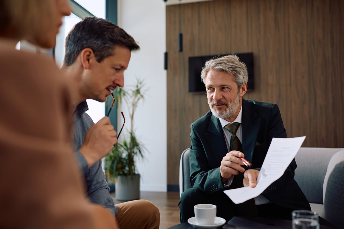 Mortgage advisor meeting with clients to discuss options
