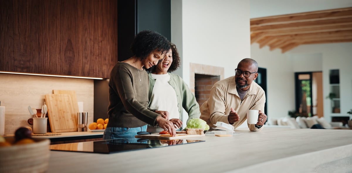 Parents, daughter and meal prep in renovated kitchen, happy family at home